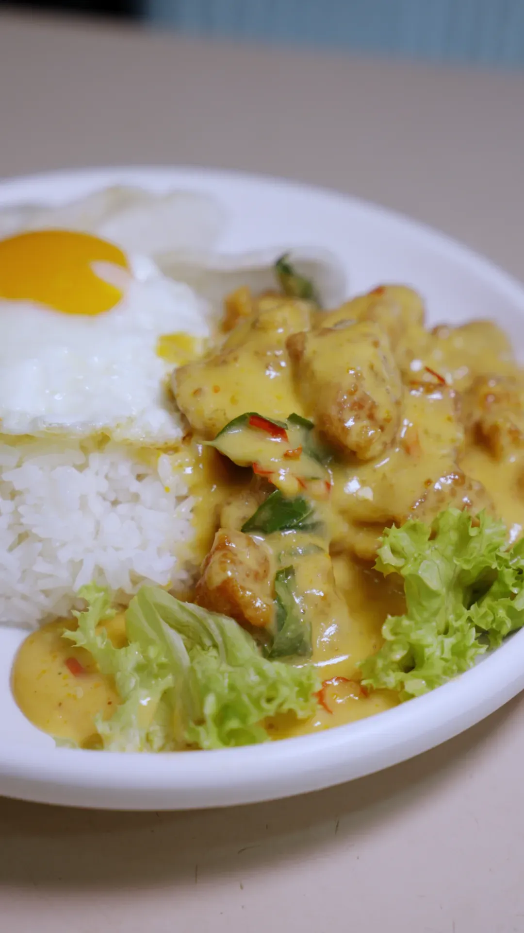 The creamy salted egg chicken rice, drenched in golden sauce